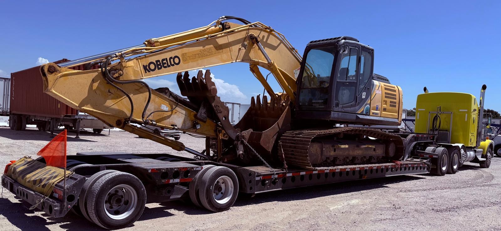 Excavadora de orugas transportada en cama baja